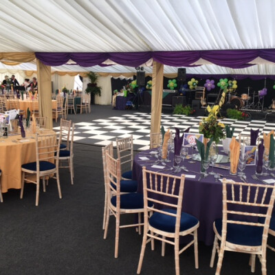 gold and purple table set up